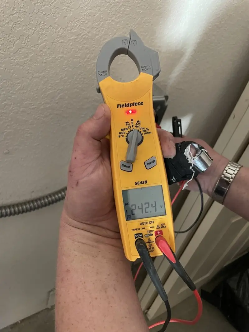 Voltage testing with clamp meter during Electrical Installation Services in Bismarck